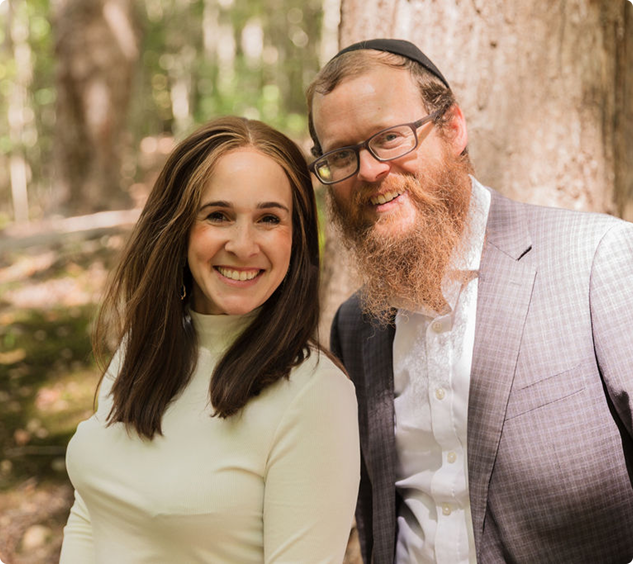 Rabbi Shneur and Zeesy Silberberg smiling together outdoors