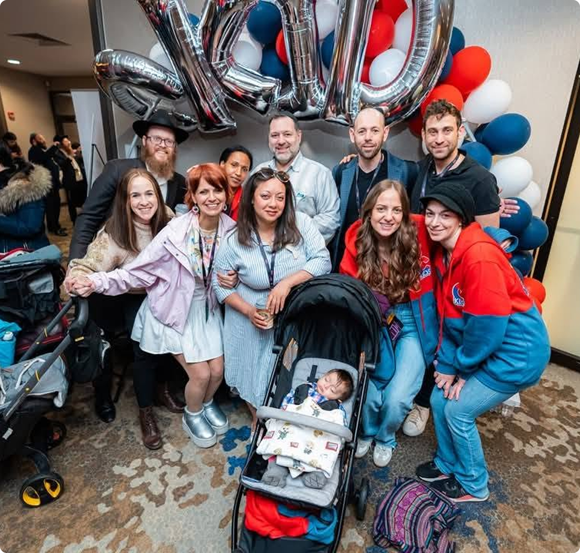 Community members celebrating together at a Bais Chabad of West Bloomfield gathering